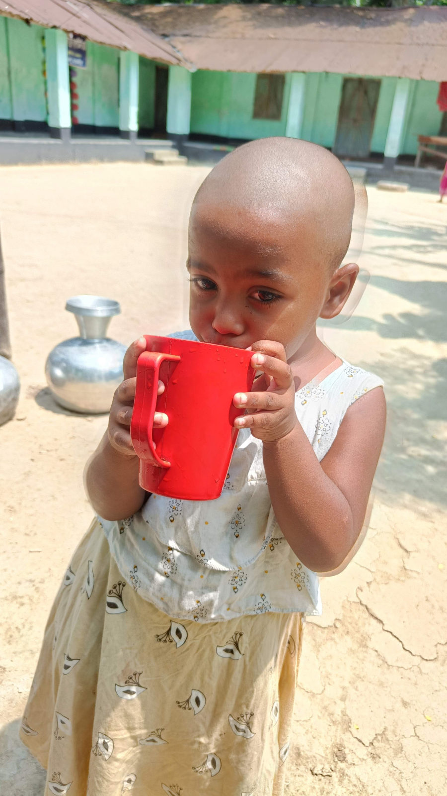 A child drinking water in Gonali