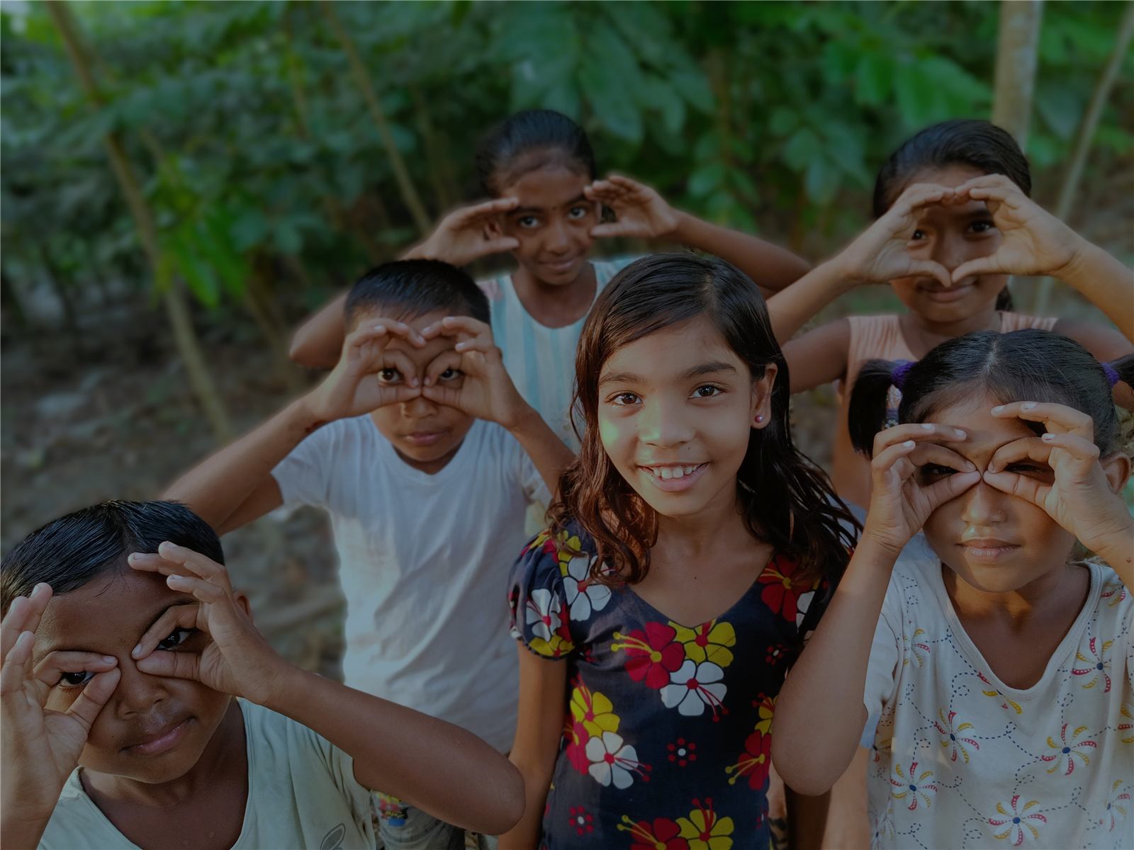 A volunteer with children in Bangladesh